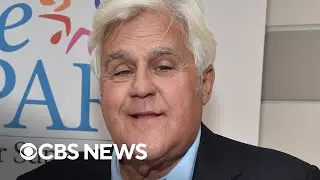 Jay Leno walking around hospital, passing out cookies to children in burn unit