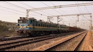 INDIAN RAILWAYS WAG7 variants -with WAP4 and WAP7 shells - with boxcars near Faridabad
