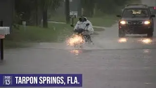 Motorists try, fail to cross flooded Florida street