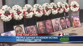 People gather in the Oregon District to honor victims