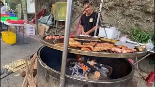 逛台湾苗栗县大山脚下豆腐街，特色原住民龙眼树烤山猪。