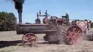 Geiser Peerless Z3 steam traction engine pulling a 12 bottom plow
