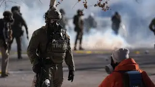 Federal agents deploy tear gas at crowd gathered at scene of deadly shooting in Minneapolis