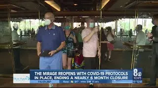 People pour into the Mirage as it opens after closing in mid-March