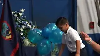 Marine surprises his son at kindergarten ceremony