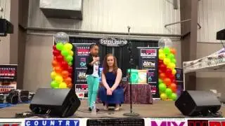 Camryn singing at Kidabaloo