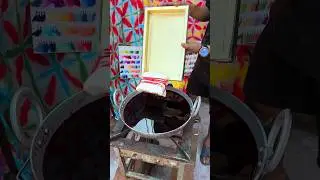 By artisans in a factory| Shibori-dye handicraft