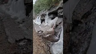 Ice Melting on Canadian Shield creates tiny waterfalls along the road to Bala, Ontario, Canada