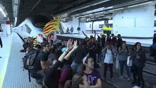 Students occupy train tracks in Barcelona's Sants station