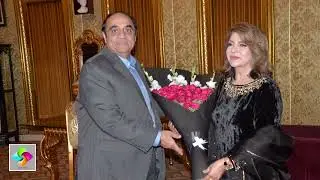International poet Rehana Qamar is welcoming the guest poets with bouquets of flowers.