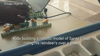 Making a Robotic Model of Santa Riding His Sleigh Over a Town