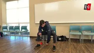 Adam coaches' seniors through his Chair Stretching Class