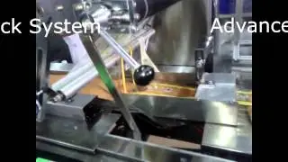Orbital flow wrap machine (Box motion flow wrap machine)