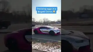 Dude throwing eggs at a bugatti