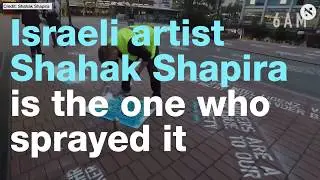 This Israeli artist sprayed hate speech graffiti in front of Twitter's office