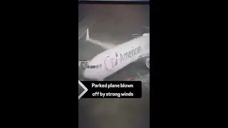 Parked plane blown off by strong winds