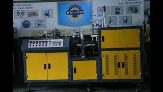 Fully Automatic paper cup machine running in factory for trial with robotic arm system.