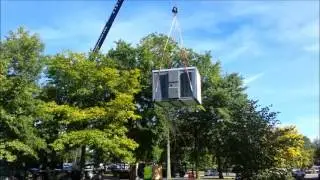 John M. Mullins Rigging and Hauling setting jumbo vending machine.