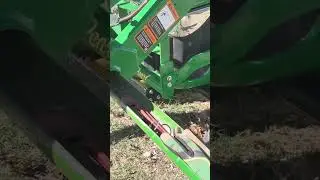Custom John Deere toolbox slides into loader frame holes
