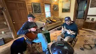 Friends in their house-“Close Proximity to the River”original (c)w/Topher Stephens claw hammer banjo