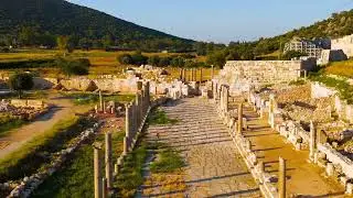 Dolly zoom. Gelemis, Turkey. Aerial flight over Colonnaded Street in Patara ancient city, low per...
