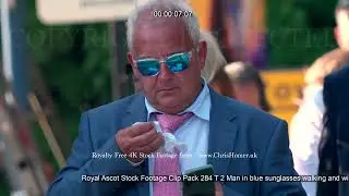 Royal Ascot Stock Footage Clip Pack 284 T 2 Man in blue sunglasses walking and wiping nose