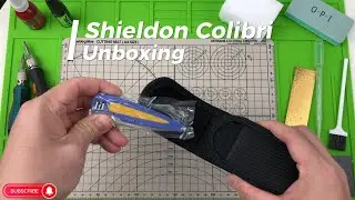 Shieldon Knives MT01A Colibri smart body on palm. small EDC blade, salute to designer's nationality