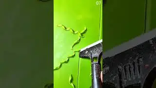 Cutting green fondant into decorative twisted ribbon edge
