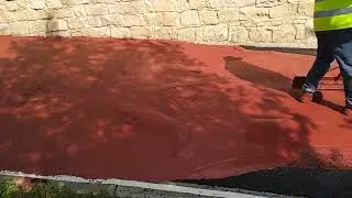 Applying red slurry seal , Kouklia Area