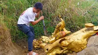 The boy was lucky to find two golden Buddha under the stone while searching for treasure in the wild