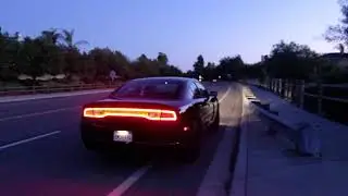 2014 Dodge Charger 5.7L V8 with Magnaflow 15803 performance exhaust, accelerating, from outside