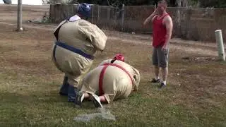 TY and Dad wrestling in Sumo suits