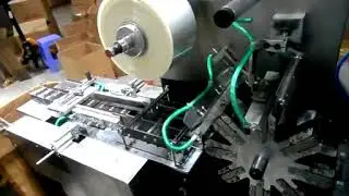Automatic cellophane overwrapping machine for boxes