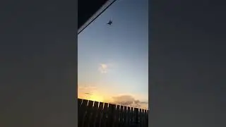Fighter jet fly over ( almost hits building )
