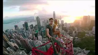 Daredevil couple take perilous selfie after climbing to the top of 'Hong Kong's highest crane
