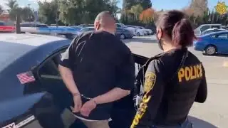 Man was handcuffed and arrested by female police officer.