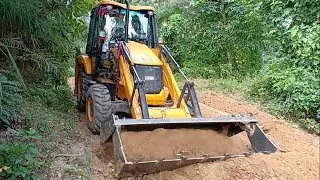 JCB Backhoe-Cutting Top of a Narrow Road-Through the Hilly Jungle