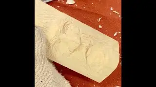 Carving a Face by Charles Sapp