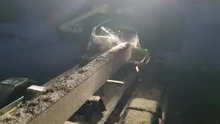 Woodlandmills HM 130 sawmill sawing at night.
