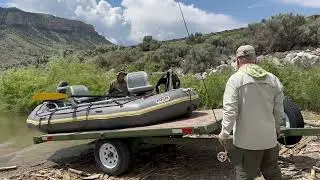 Loading raft on tilt deck trailer with electric remote winch