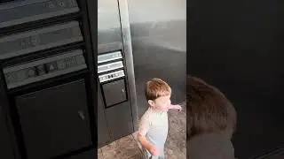 #Toddler rides #Dover #elevator in #parkinglot on a #windy day.