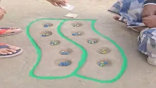 তারা মার্বেল দিয়ে 10 গাতার খেলা খেলতাছে | They are playing a game of marbles with 10 marbles.