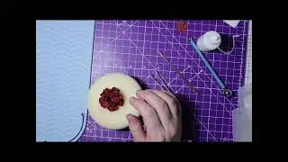 Burgundy red flower forming foam flowers on a card