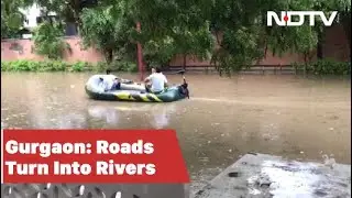 Boat On Waterlogged Road, Submerged Underpasses: Rain Paralyses Gurgaon