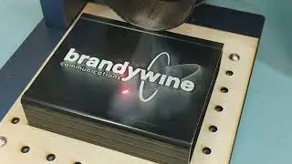 Time-lapse fiber laser engraving on powder coated aluminium enclosure.