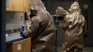Wearing a Level A Chemical Suit
