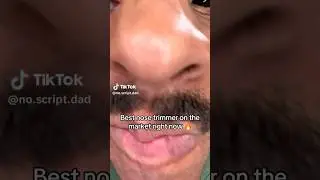 Man with big nose trimming nose hairs