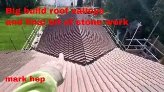 extension build finishing stone walls and tilling roof valleys