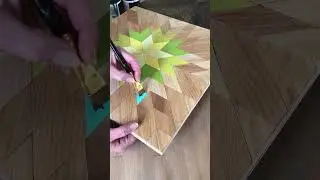Painting wooden barn quilt art. Bursting star quilt block. Yellow Green Blue Turquoise. Art Process