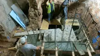 Forming and pouring concrete in elevator shaft